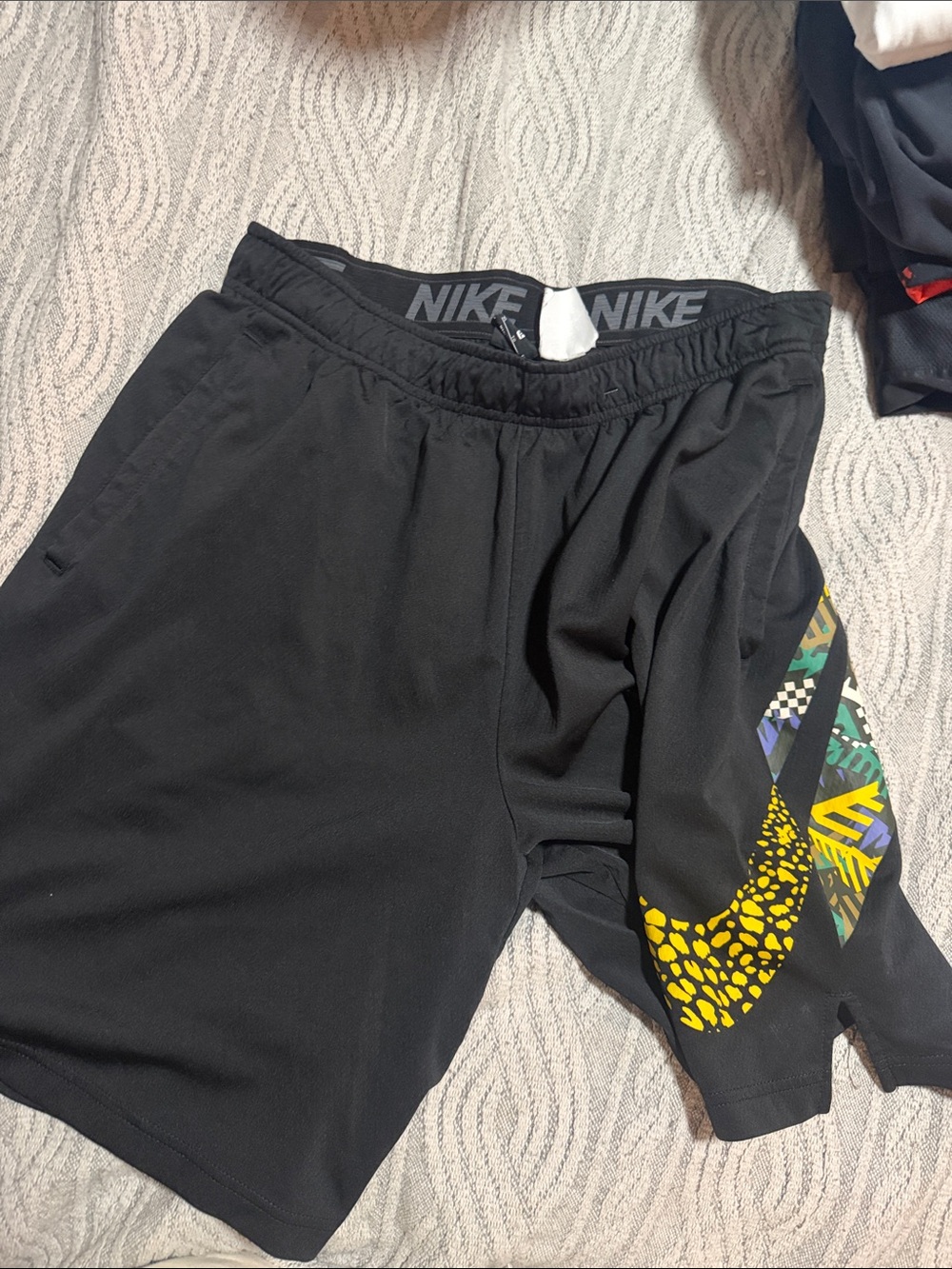 Nike Men’s Black Athletic Shorts with Yellow Graphic Swoosh Accent